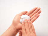 Foam from ORBIS Powder Wash on palm with other hand rubbing